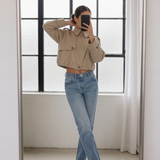 Back view of the Darcy tan cropped trench coat