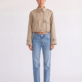 Woman wearing the Darcy tan cropped trench coat, front view