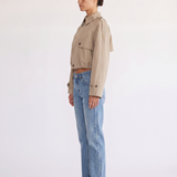 Model styling the Darcy tan cropped double-breasted trench coat