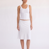Woman wearing the Madison Skirt white scallop waist skirt, front view