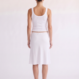 Model styling the Madison Skirt white scallop waist skirt