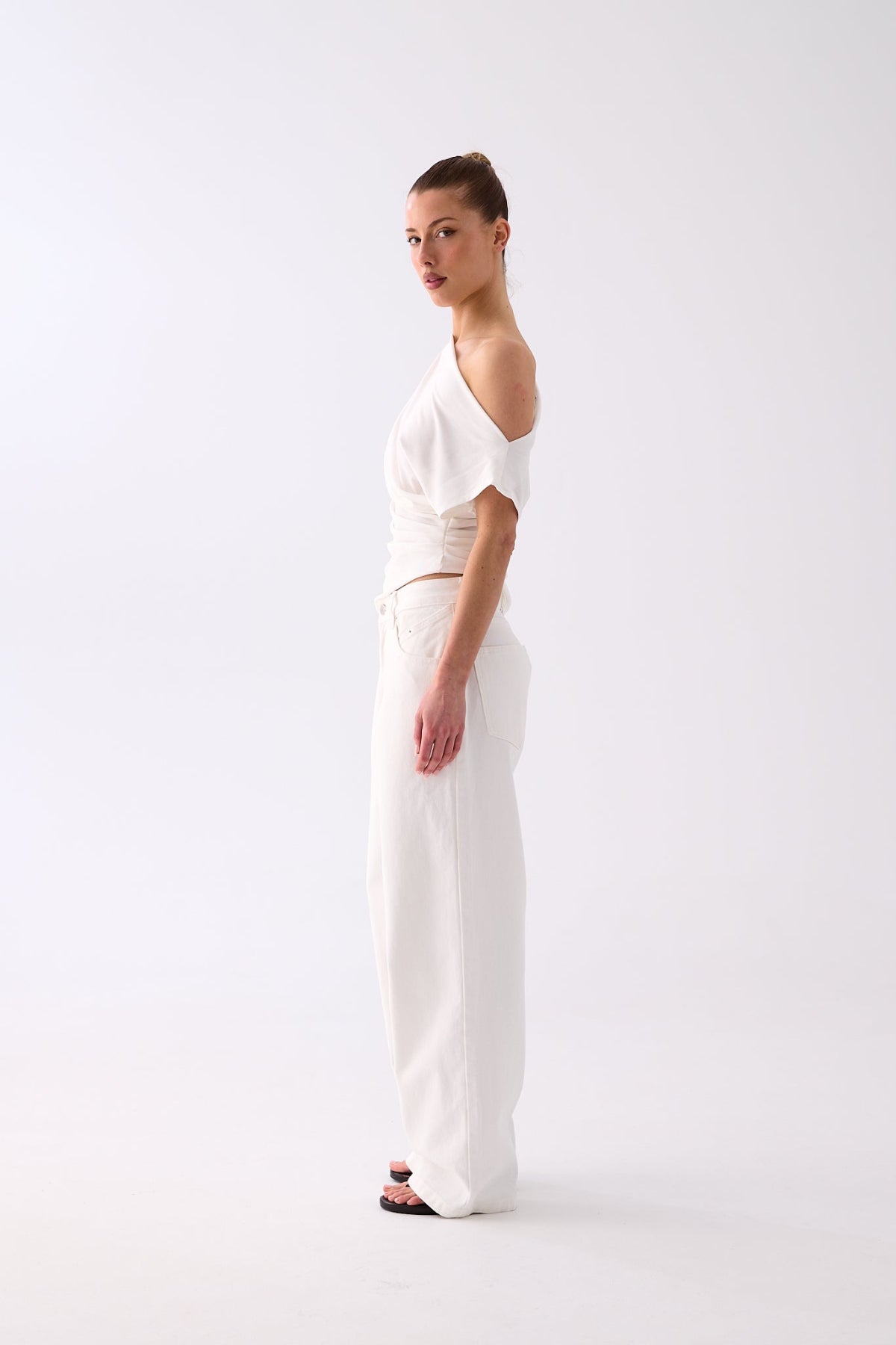 Model styling the Leona white baggy jeans