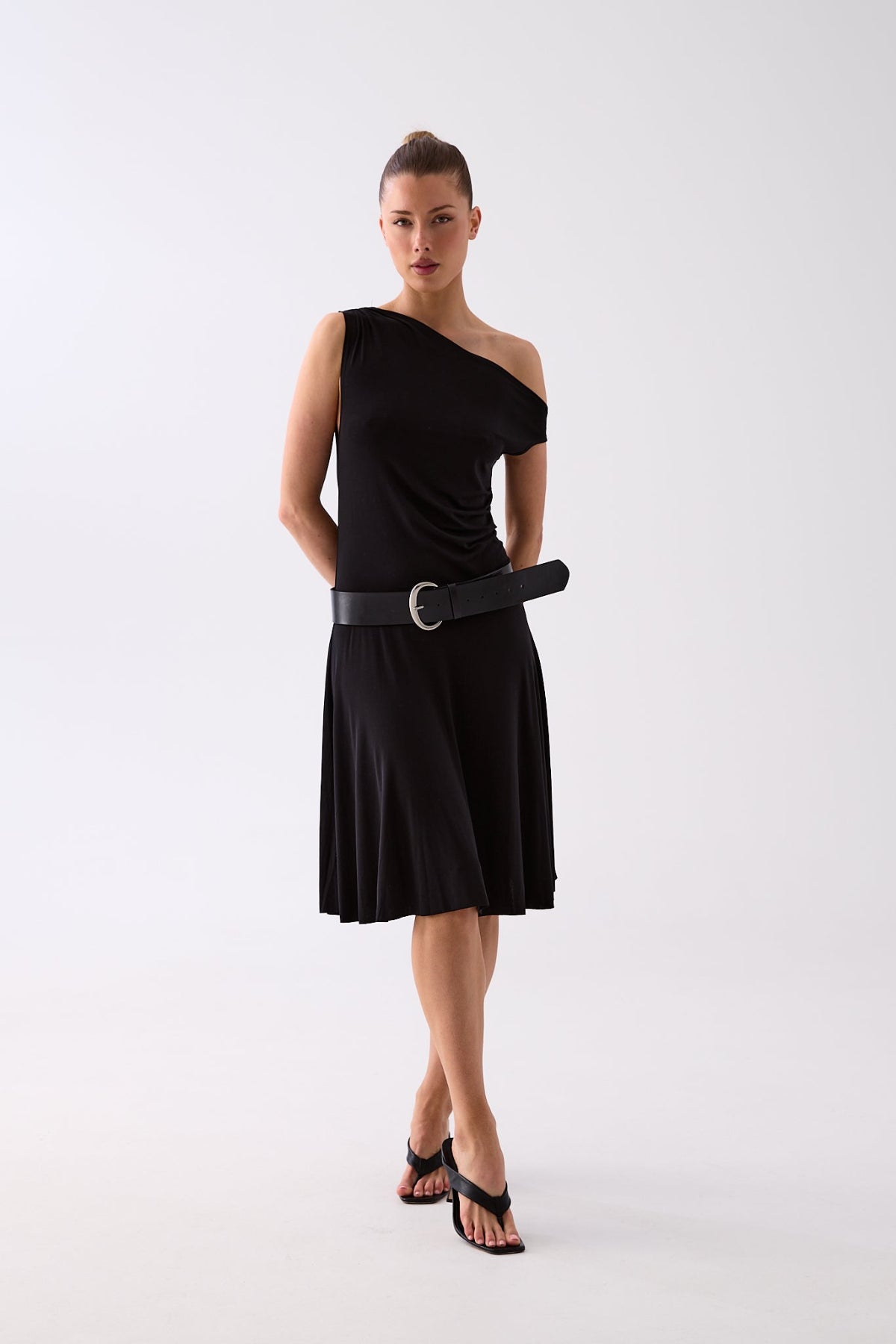 Model styling the Demi black wide belt over a blazer