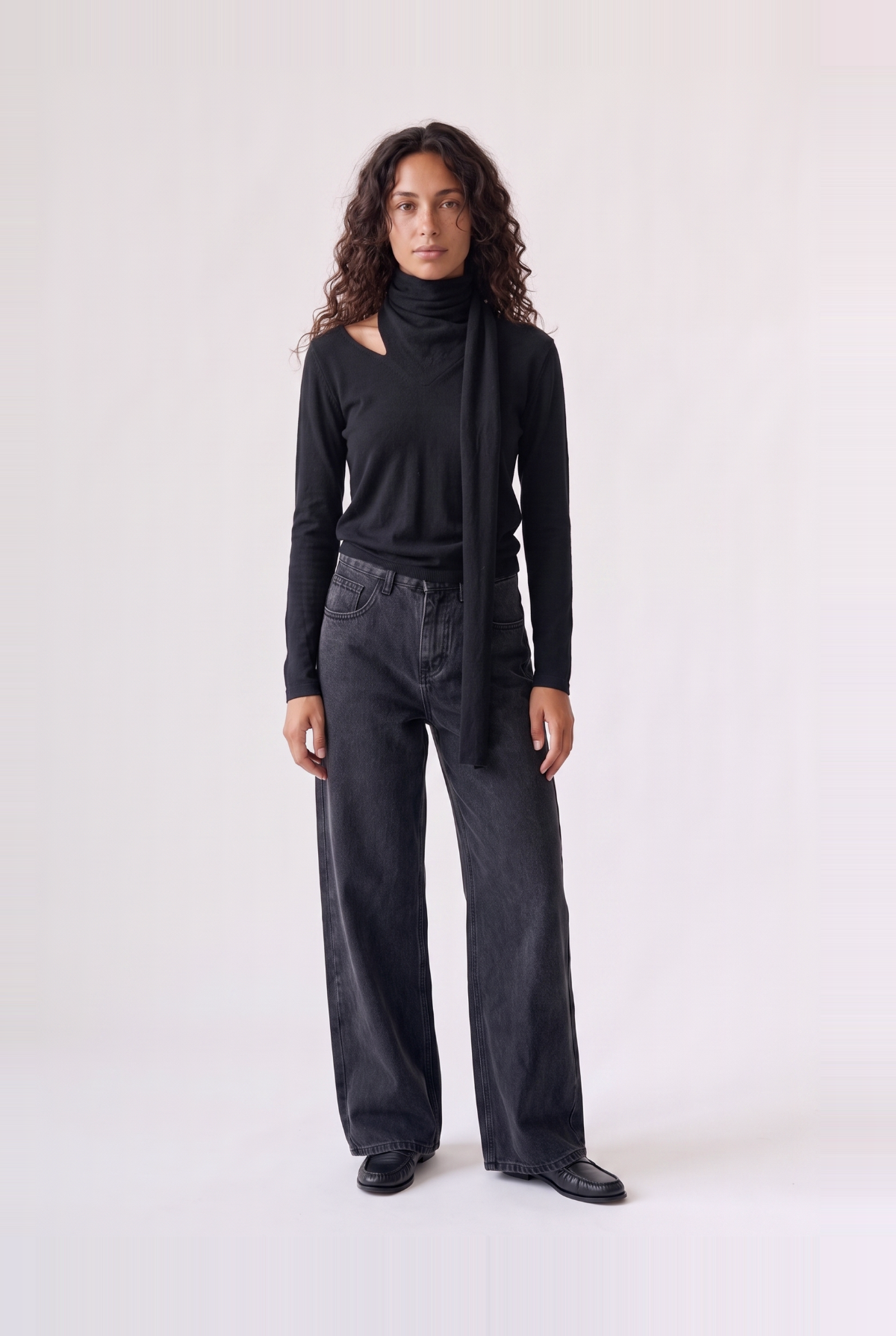 Wren Top in black — front view of the soft knit long-sleeve top with attached draped scarf