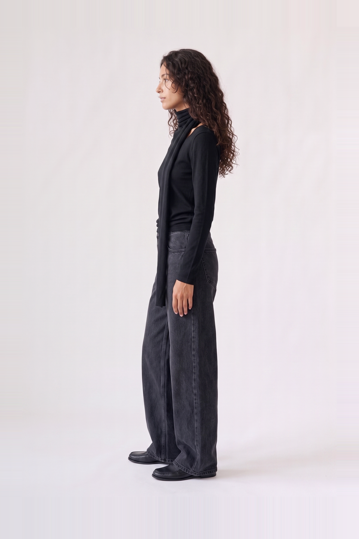Wren Top in black — side view showing the draped scarf falling from the shoulder
