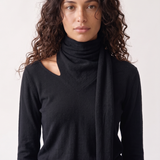 Wren Top in black — close-up of the knit fabric and draped scarf detail
